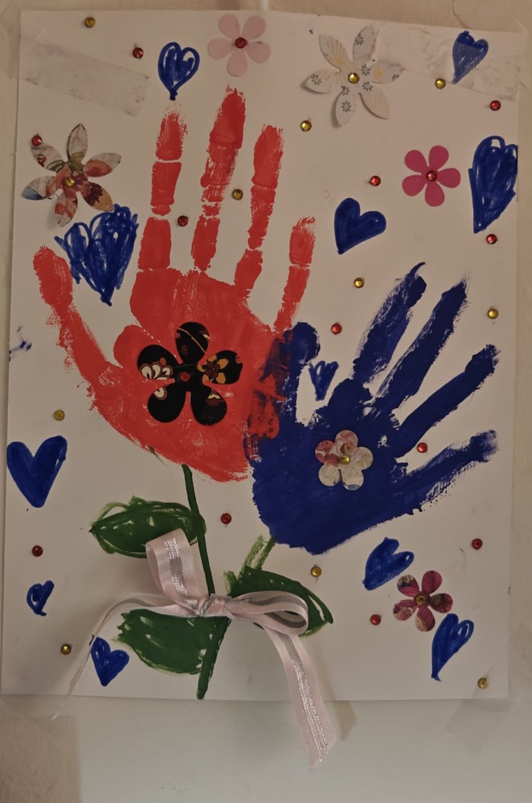 Finished handprint artwork created at a Mom and Me workshop